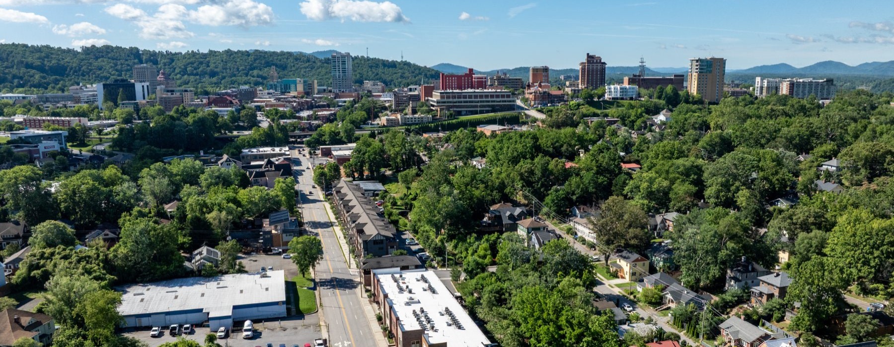 a city with many buildings and trees