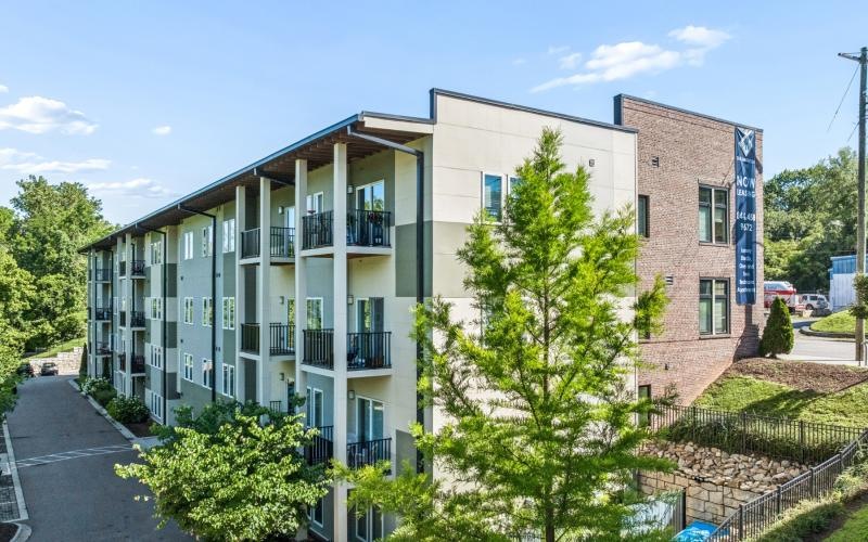 a building with trees in front of it